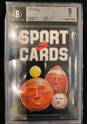 1985 Nike cover card Upper left corner is cracked and small plastic piece is missing.  No damage to card. 