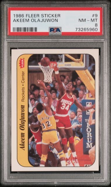 1986 Fleer Sticker Akeem Olajuwon #9 PSA 8 (BillsGridironGreats)