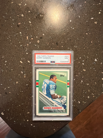 Here’s a polished description for your Barry Sanders 1989 Topps Traded Rookie Card #83T, graded PSA Mint 9
