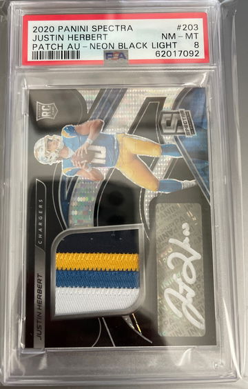 2020 spectra Justin Herbert neon black light PSA 8