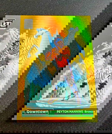 2023 Peyton Manning Panini Donruss Optic Downtown Gold Prizm 7/10 #D-9 DOWNTOWN! SP