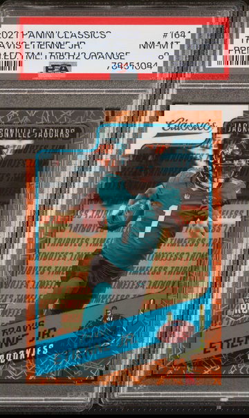 2021 Panini Classics Premium Edition Timeless Tributes H2 Orange Travis Etienne Jr. #164 /10 PSA 8