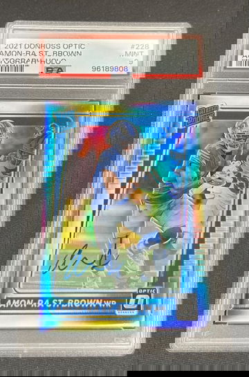 2021 Amon Ra St Brown Panini Donruss Optic Rookie Holo Prizm Auto /125 PSA 9 #228 RC SP Autograph