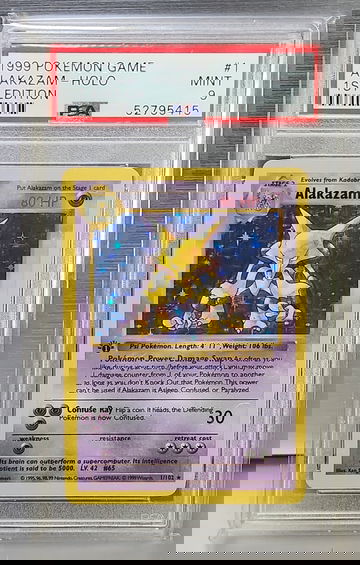1999 Pokémon Game Alakazam #1 – 1st Edition Holo – PSA 9 MINT