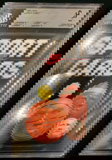 1985 Nike cover card Upper left corner is cracked and small plastic piece is missing.  No damage to card. 